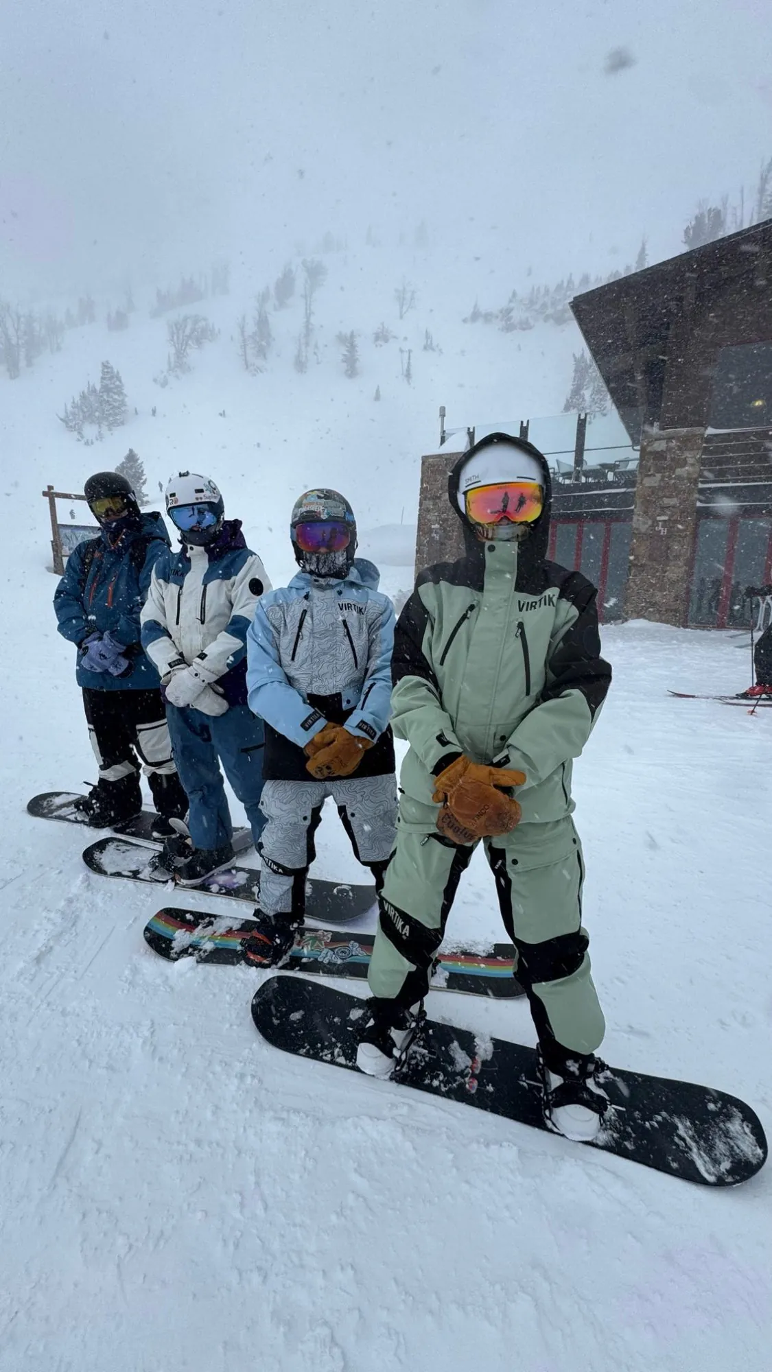 Four snowboarders